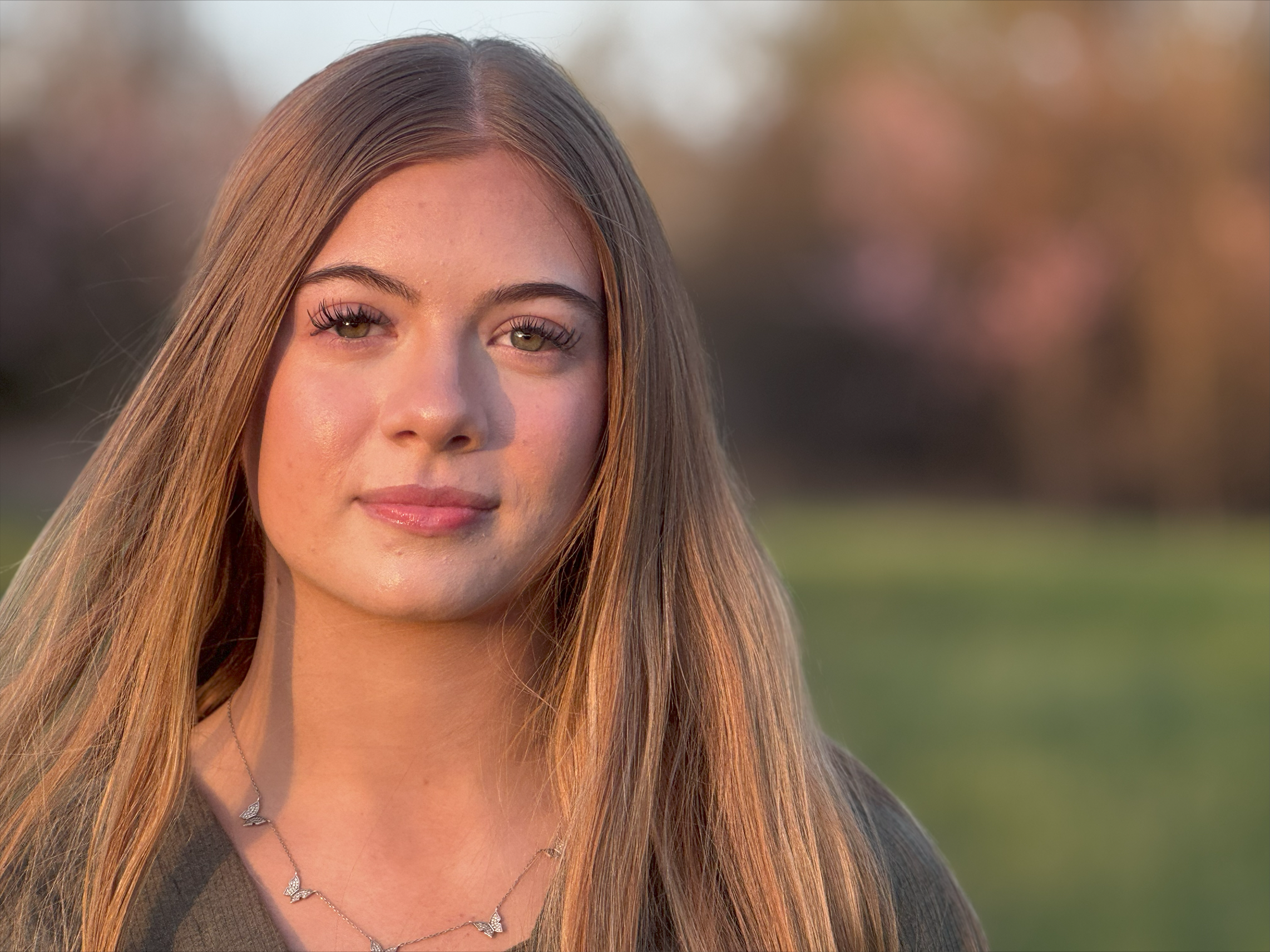 girl standing in the woods